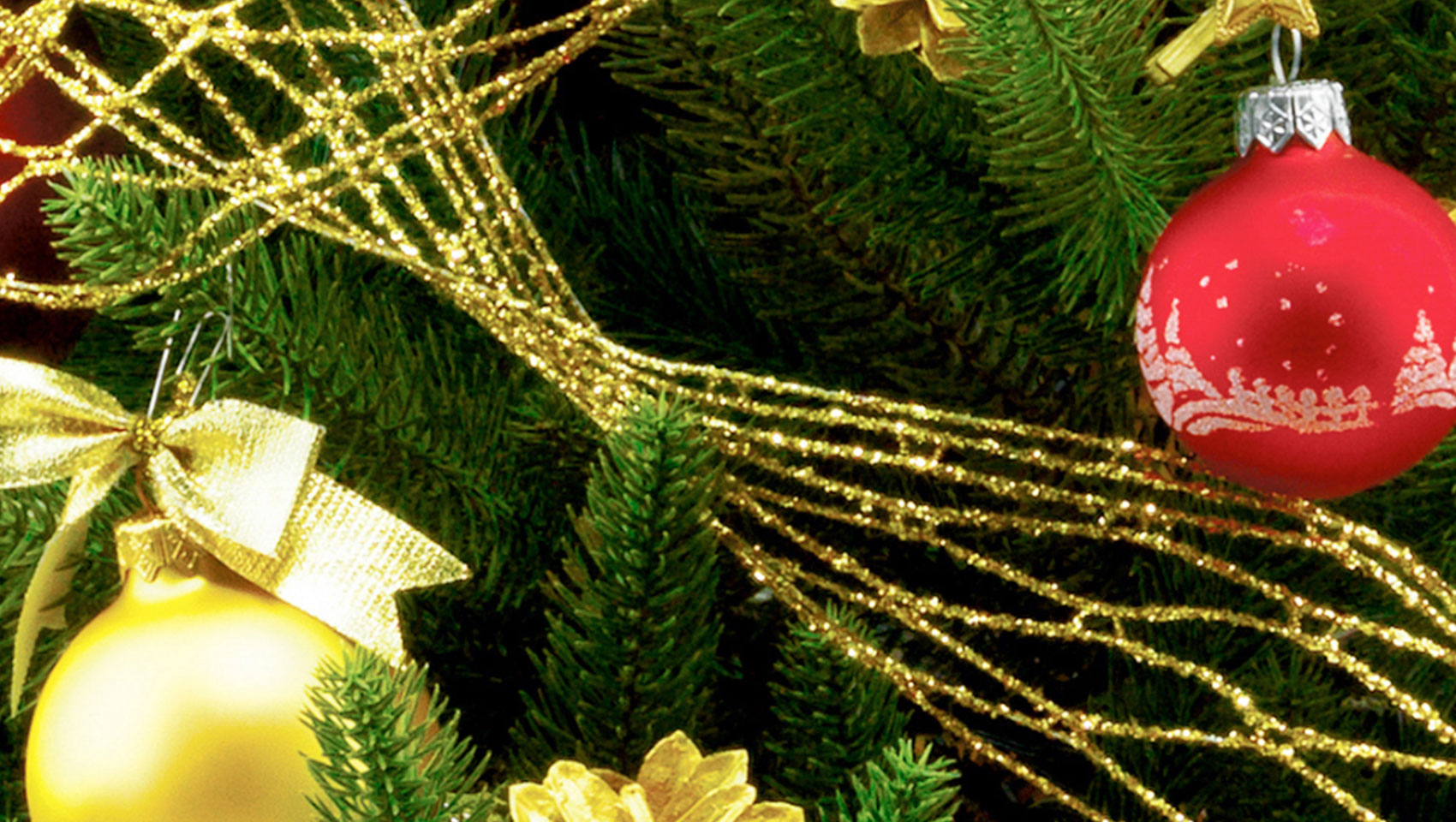 Red and Gold holiday decorations on greenery